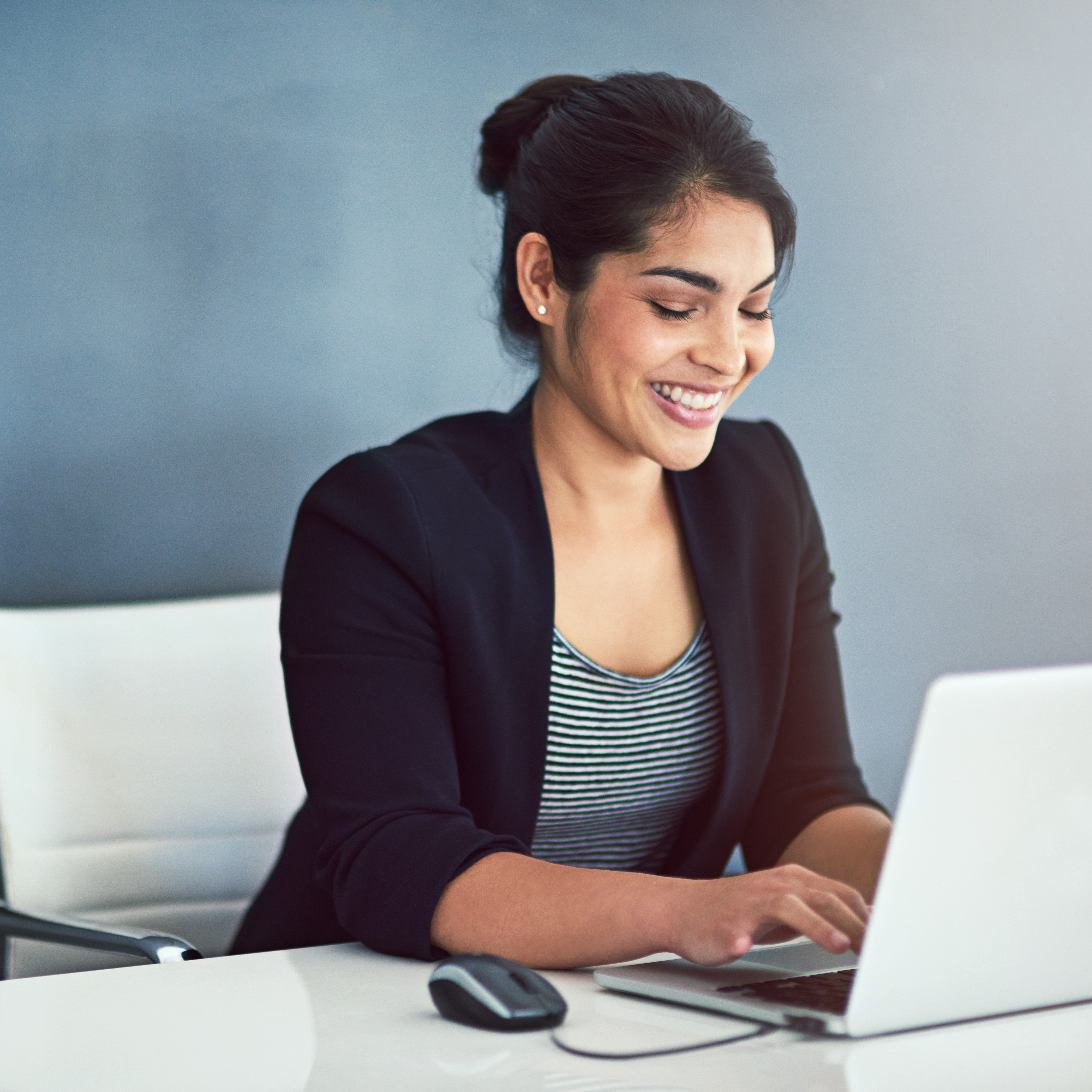 Expert smiling at desk